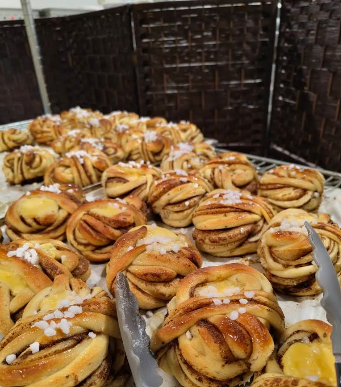 Tray of golden Swedish cinnamon buns, fresh from the oven